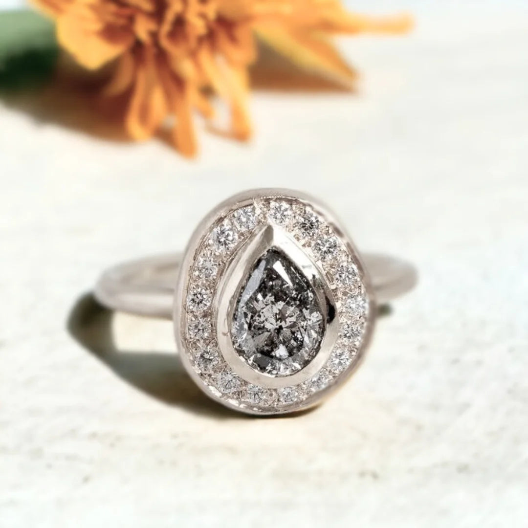 Victorian Salt and Pepper Diamond Ring Timeless Design With Vintage Charm featuring a natural grey round salt-and-pepper diamond, sparkling round side diamonds, and a Victorian-inspired ring design with a straight shank band and vintage-style detailing.