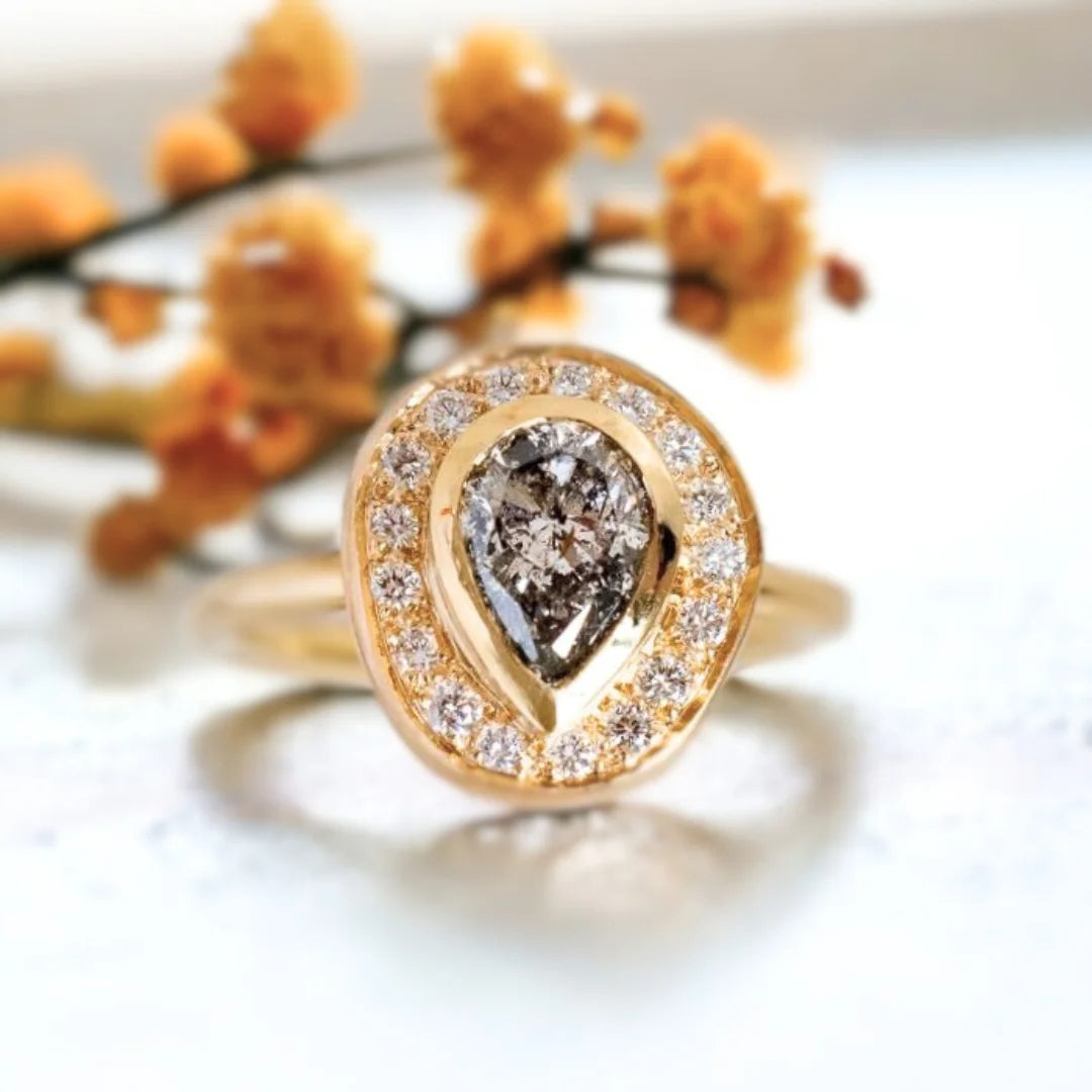 Victorian Salt and Pepper Diamond Ring Timeless Design With Vintage Charm featuring a natural grey round salt-and-pepper diamond, sparkling round side diamonds, and a Victorian-inspired ring design with a straight shank band and vintage-style detailing.