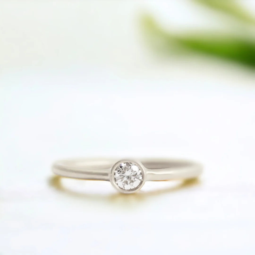 Yellow Gold Diamond Solitaire Ring Minimalist 0.55 CT White Diamond featuring a round brilliant-cut white diamond set in polished yellow gold with a slim band and clean, straight shank solitaire design