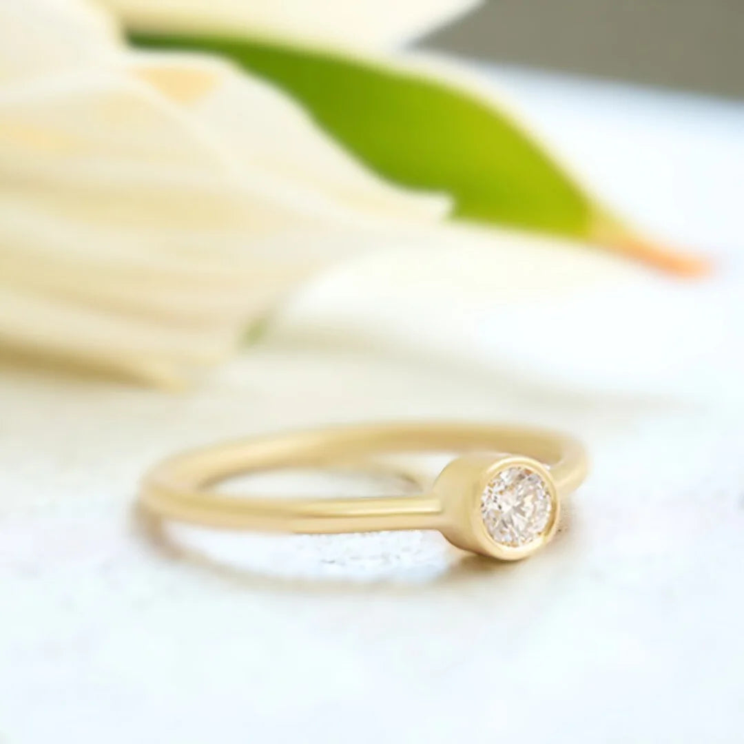 Yellow Gold Diamond Solitaire Ring Minimalist 0.55 CT White Diamond featuring a round brilliant-cut white diamond set in polished yellow gold with a slim band and clean, straight shank solitaire design