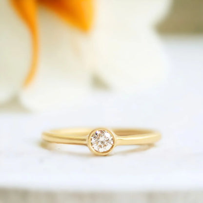 Yellow Gold Diamond Solitaire Ring Minimalist 0.55 CT White Diamond featuring a round brilliant-cut white diamond set in polished yellow gold with a slim band and clean, straight shank solitaire design